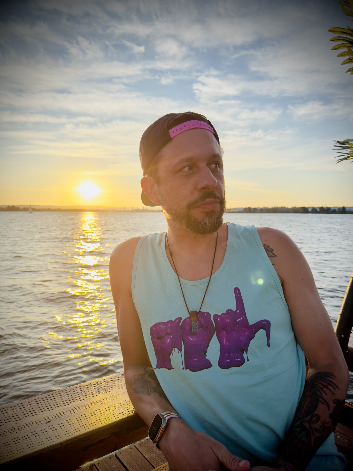 toneDAMAGE wearing Deafiant clothing at golden hour, dockside, 2025.